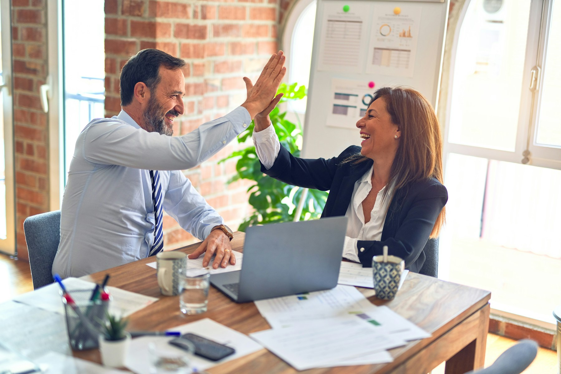 Human resources professionals collaborating in office