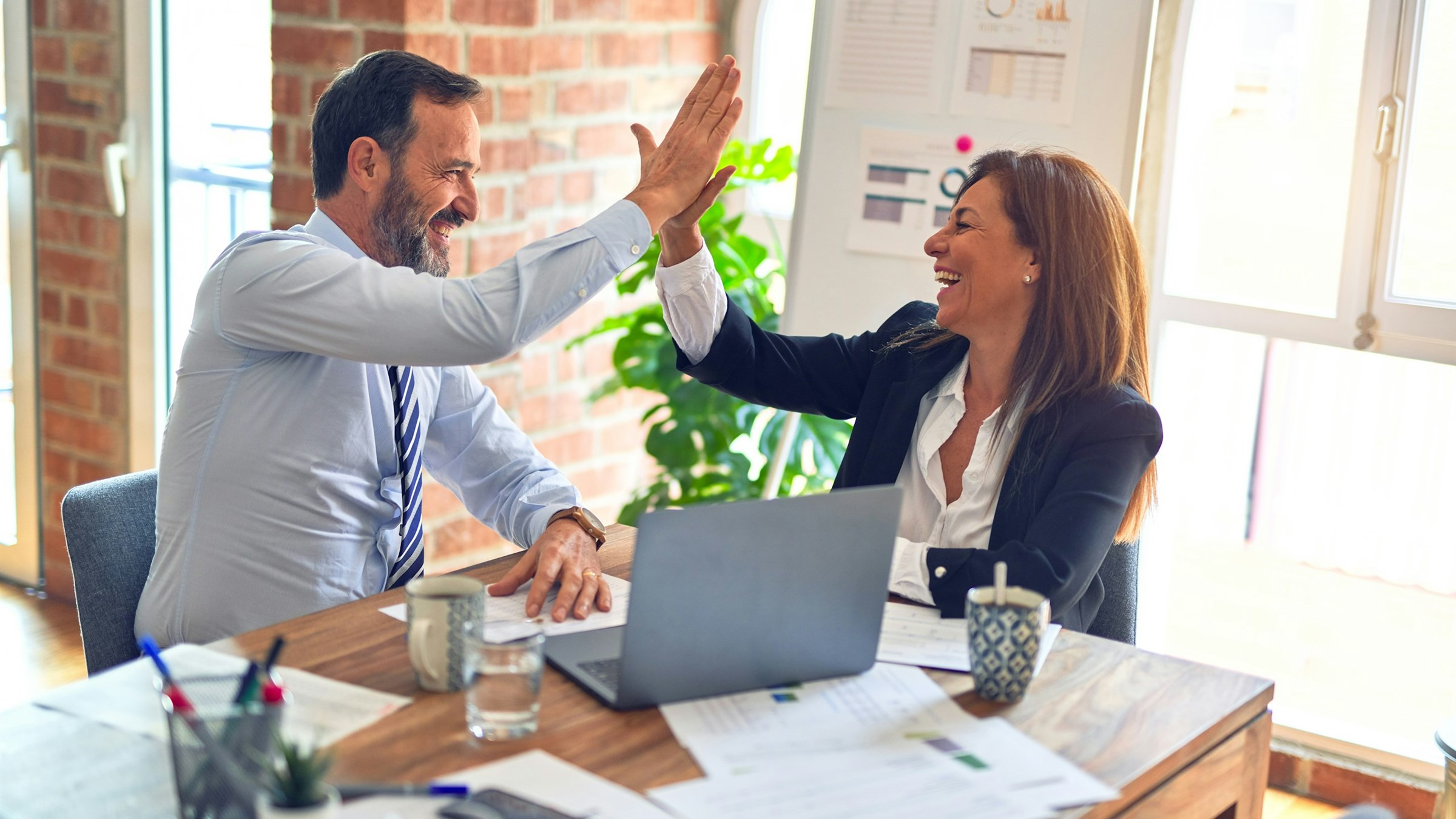 Financial advisor consulting clients in a modern investment office